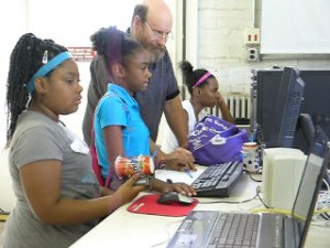 Volunteer and youth in the Fab Lab (U Illinois I-STEM photo)